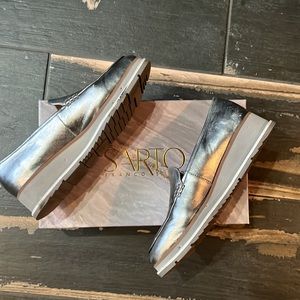 Gently worn silver leather loafer